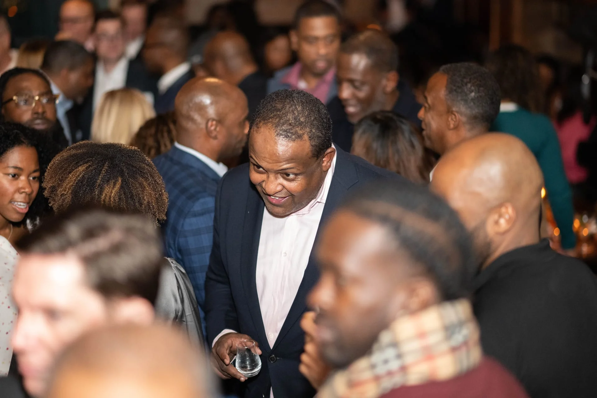 Members networking at a JUST Society conference reception